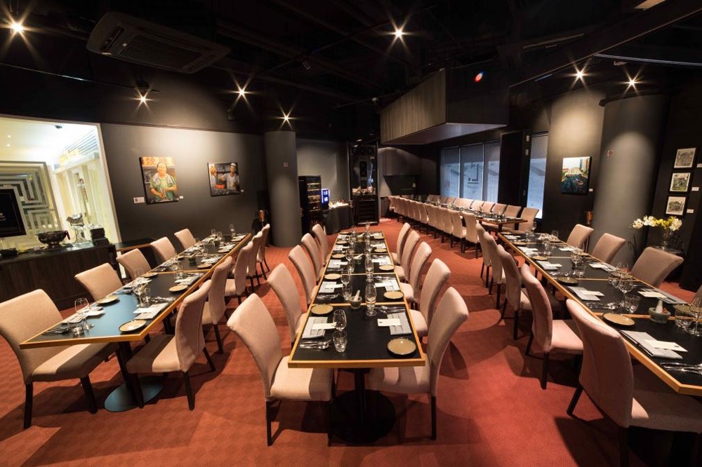 Labyrinth dining room dark walls long tables